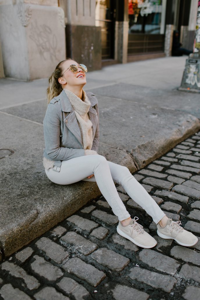 Payton Sartain wears a neutral Nike sneaker with a neutral spring outfit in New York City