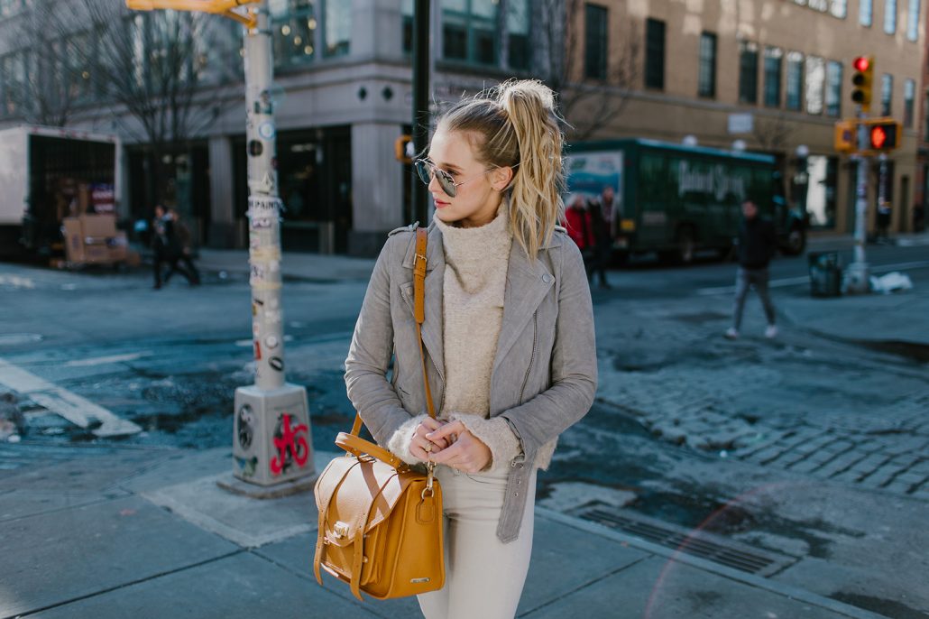 Blogger Payton Sartain of Hustle + Halcyon wears neutral colors shopping in New York City