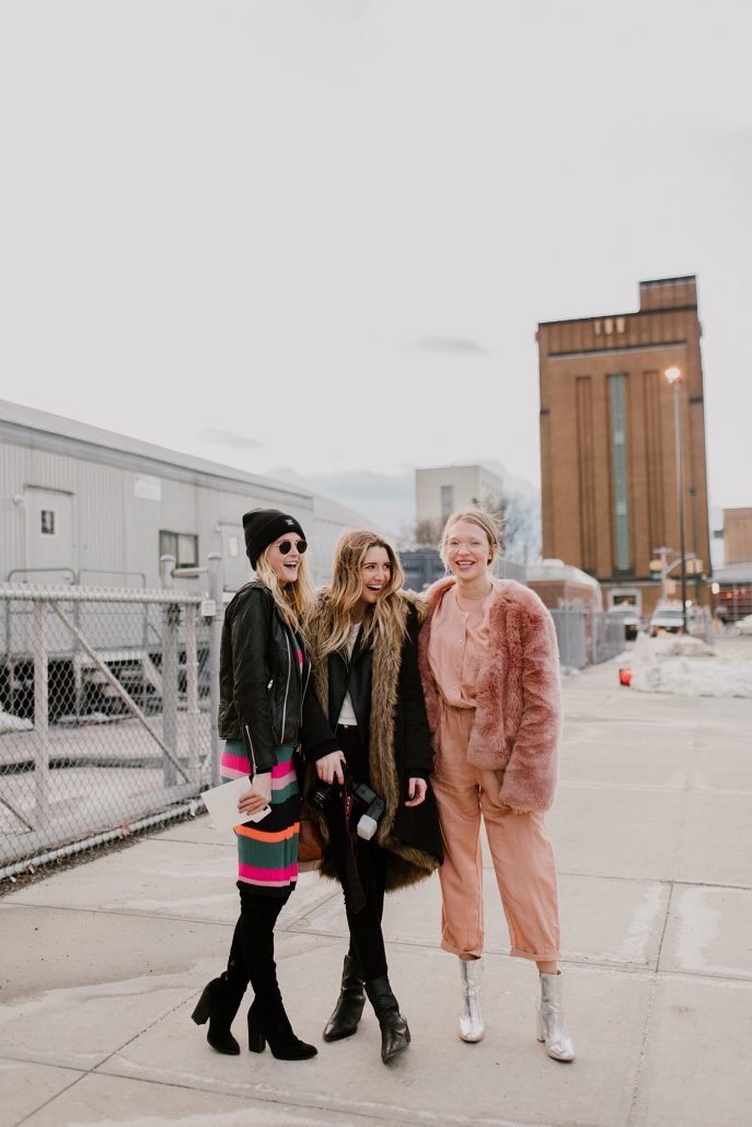 Bloggers Payton Sartain and Molly Hogan hang with their photographer, Haley Ringo, outside of the Mara Hoffman presentation during New York Fashion Week
