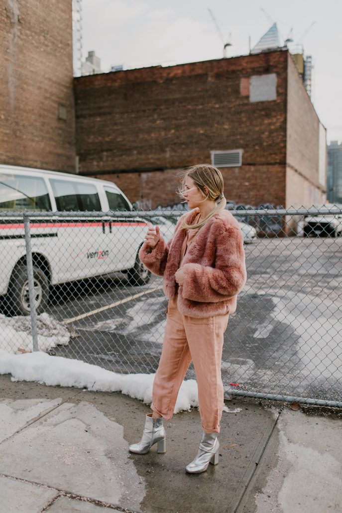 Hustle + Halcyon wears Free People & Somedays Lovin' outside of the Mara Hoffman presentation during New York Fashion Week