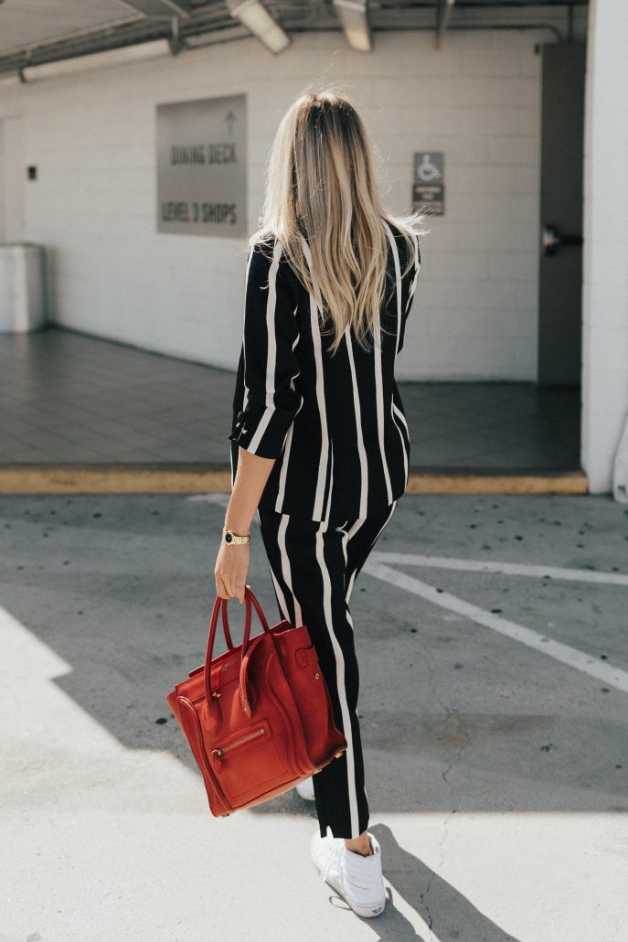 Blogger Payton Sartain wears a River Island Suit for Fall