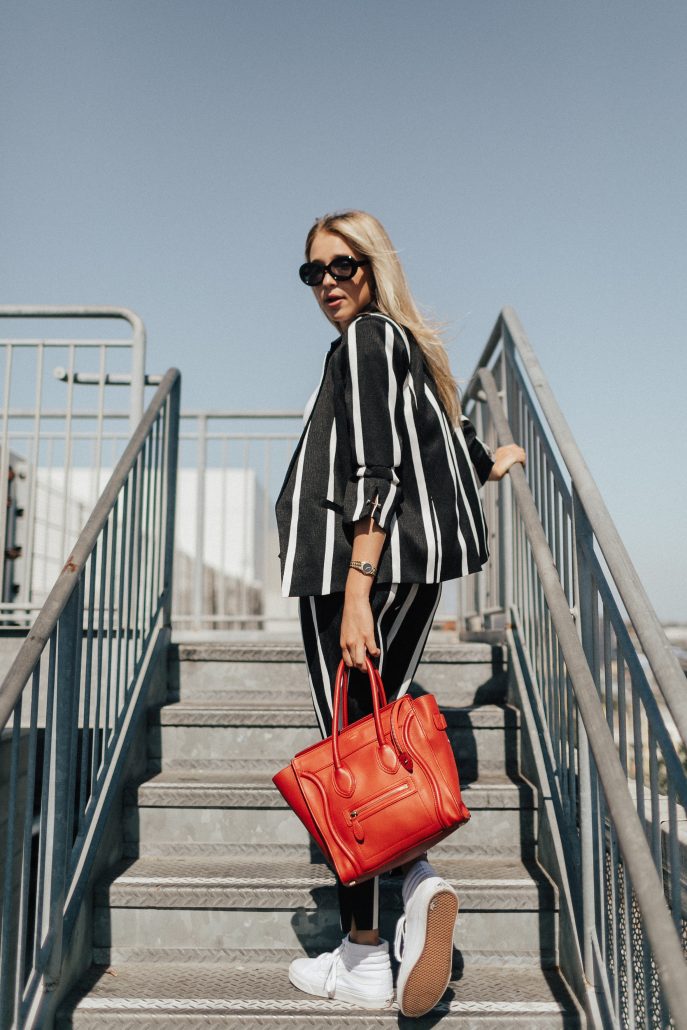 Blogger Payton Sartain wears a River Island suite for Fall