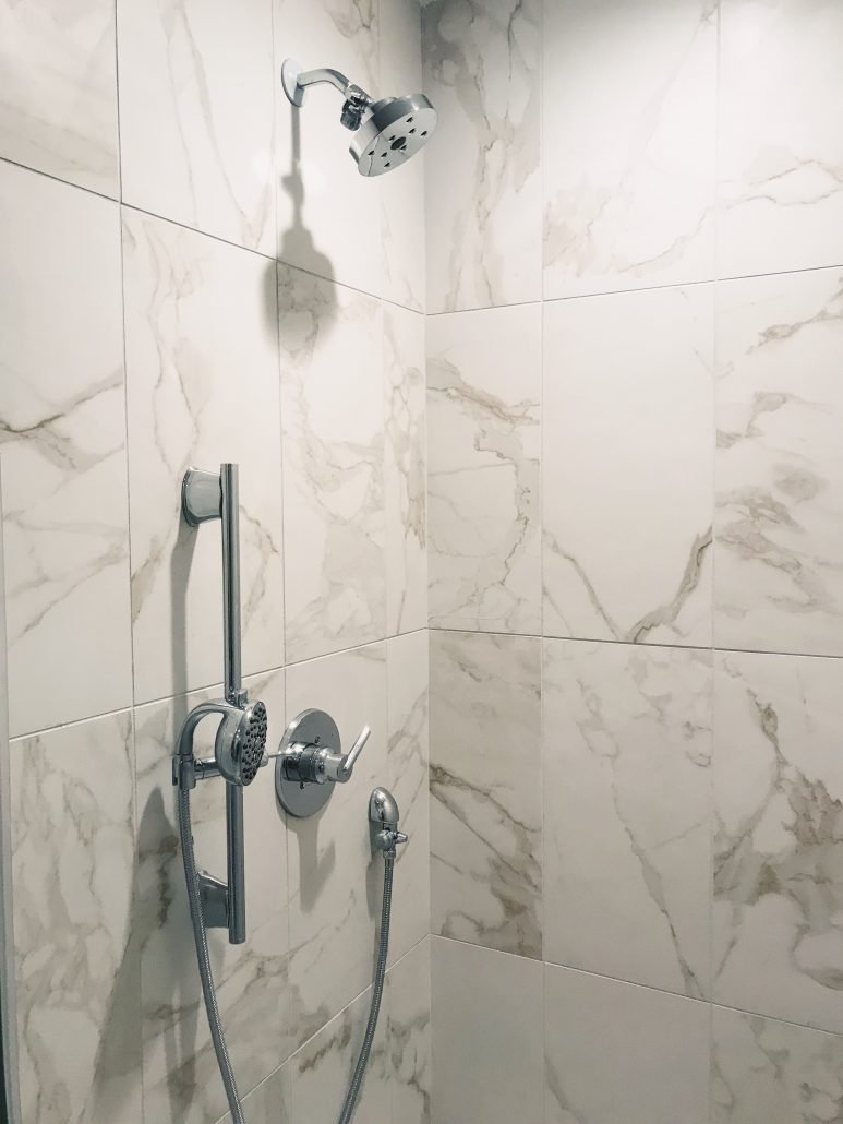 Marble Shower with Silver Accents / Hustle + Halcyon